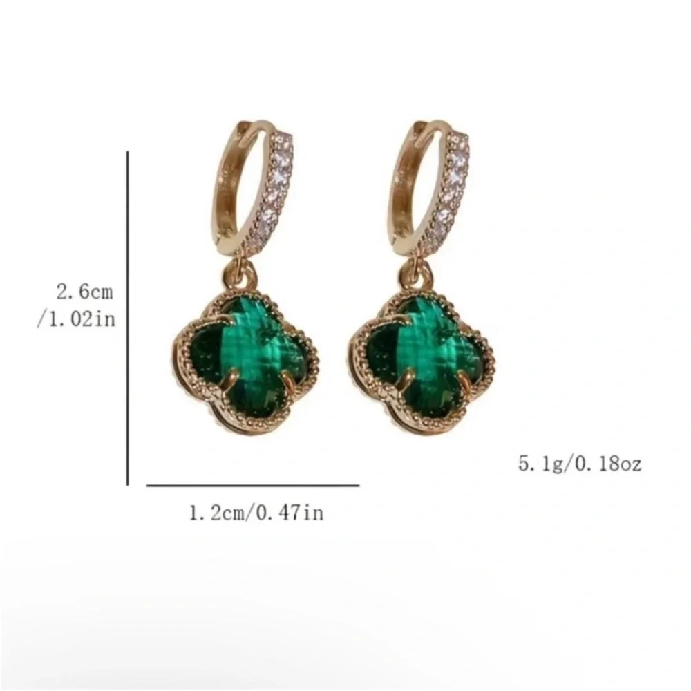 clover-shaped dangle earrings featuring green stones and gold plating with paved